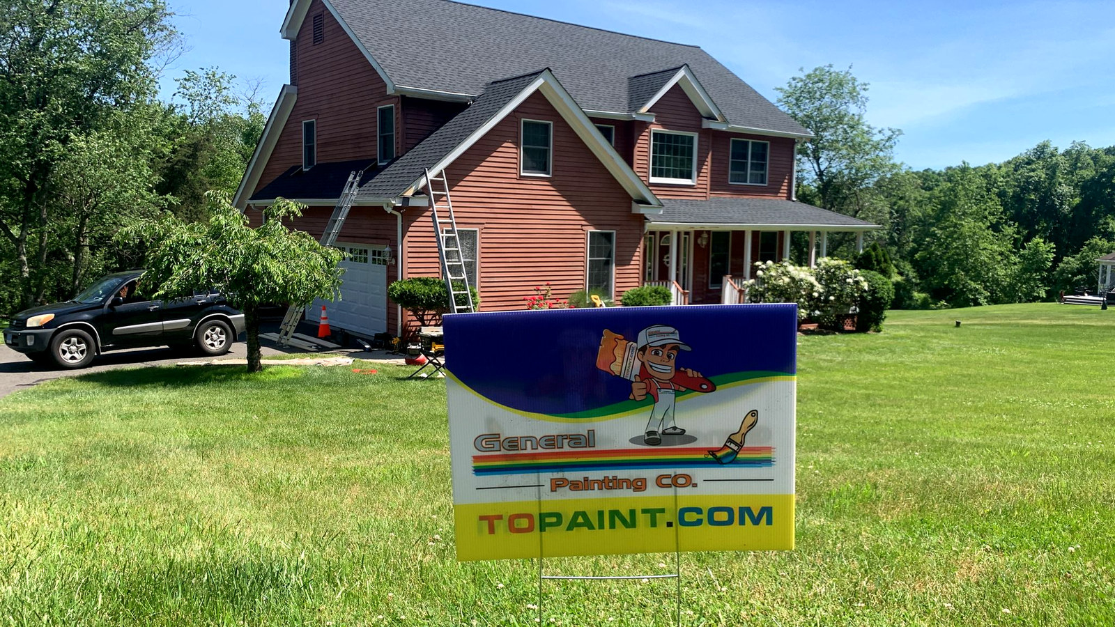Red farmhouse with wraparound porch — Connecticut painting contractor