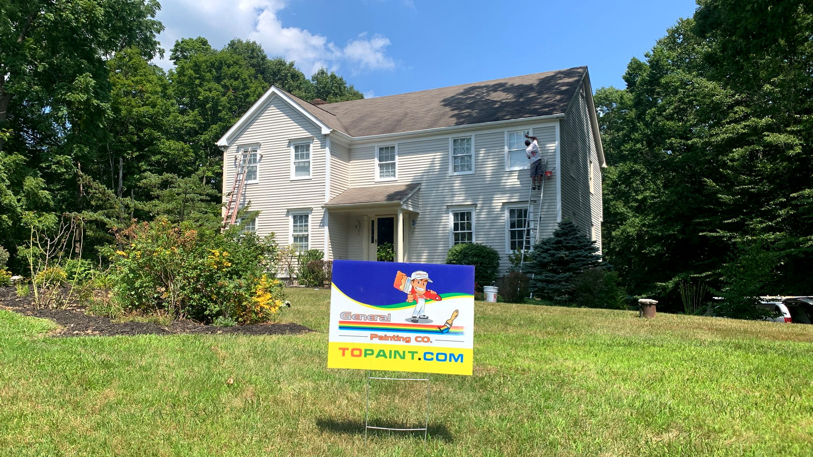 White colonial home in Connecticut with yard sign